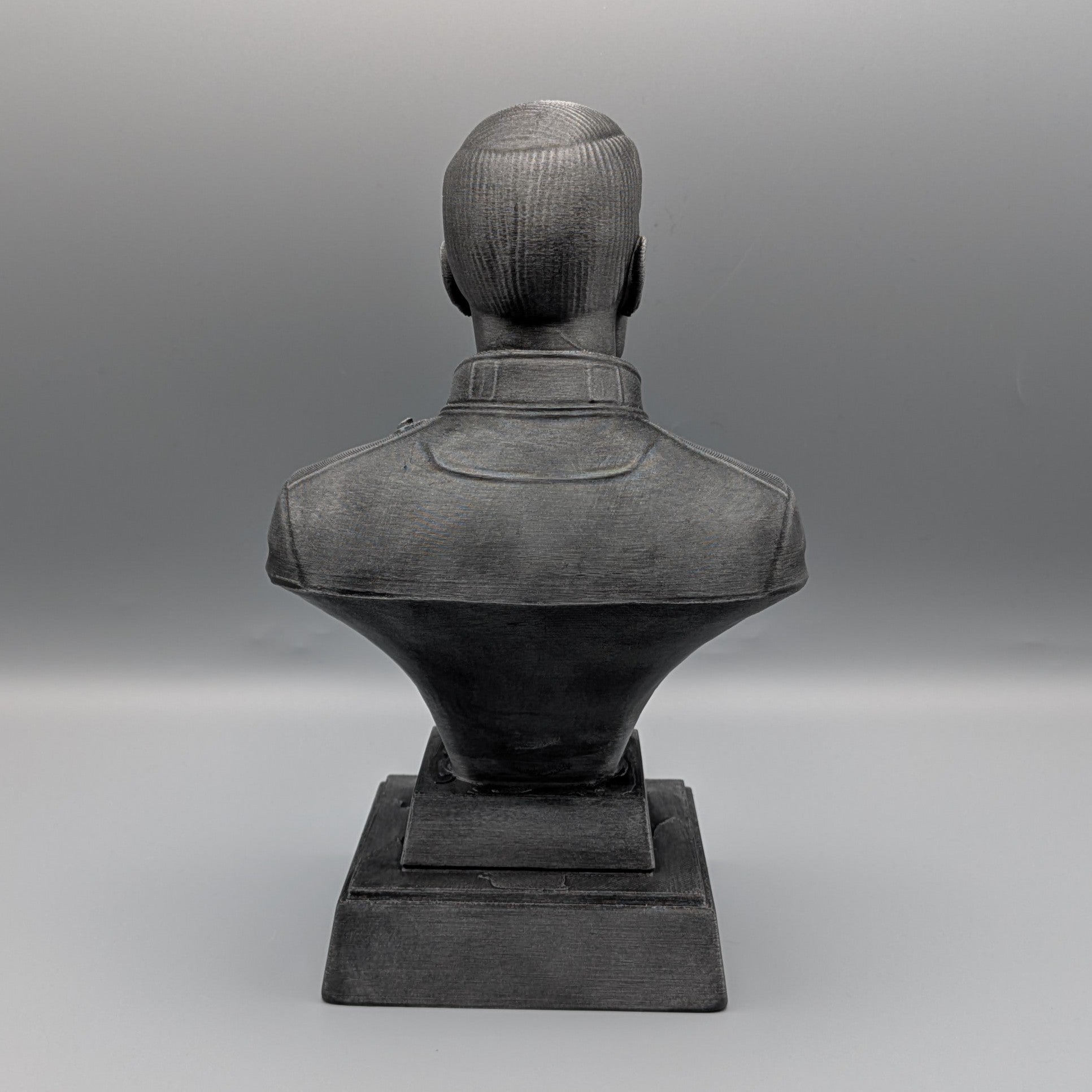 Rock tribute bust on pedestal base black and silver