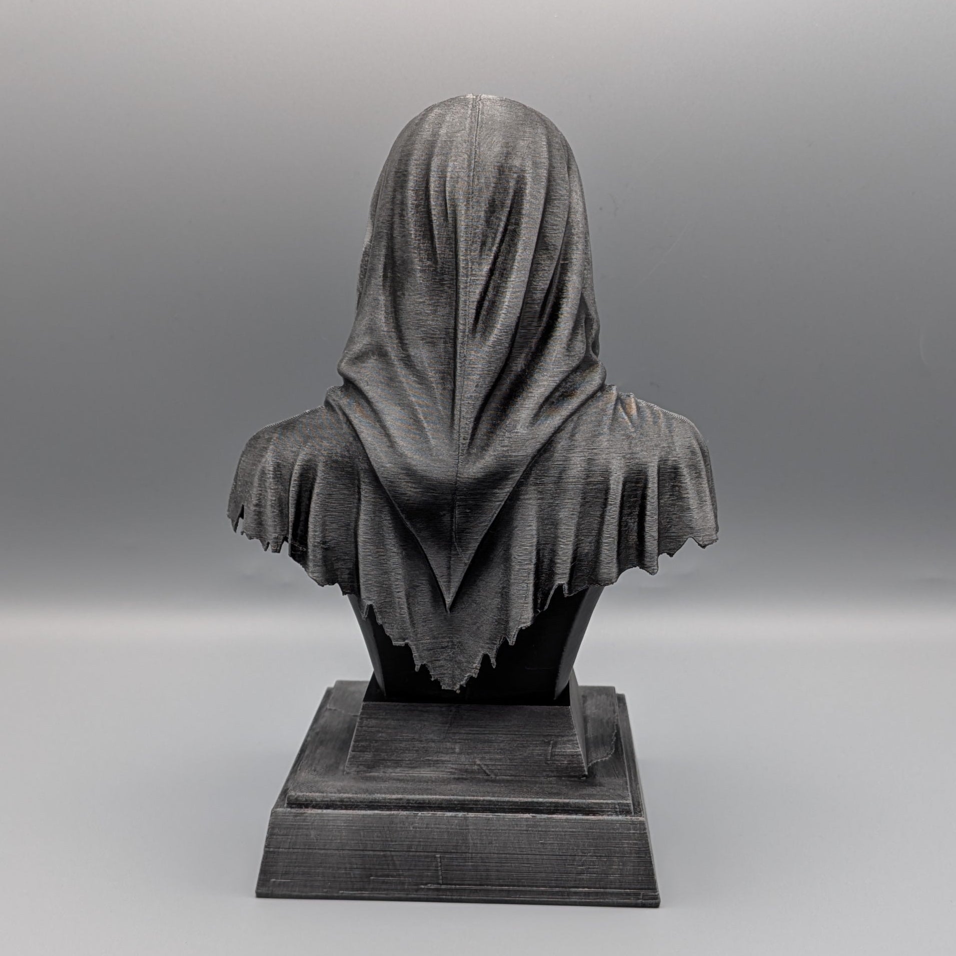 Back view of the silver Ghostface tribute bust showing the flowing hood, tattered robe and pedestal base.