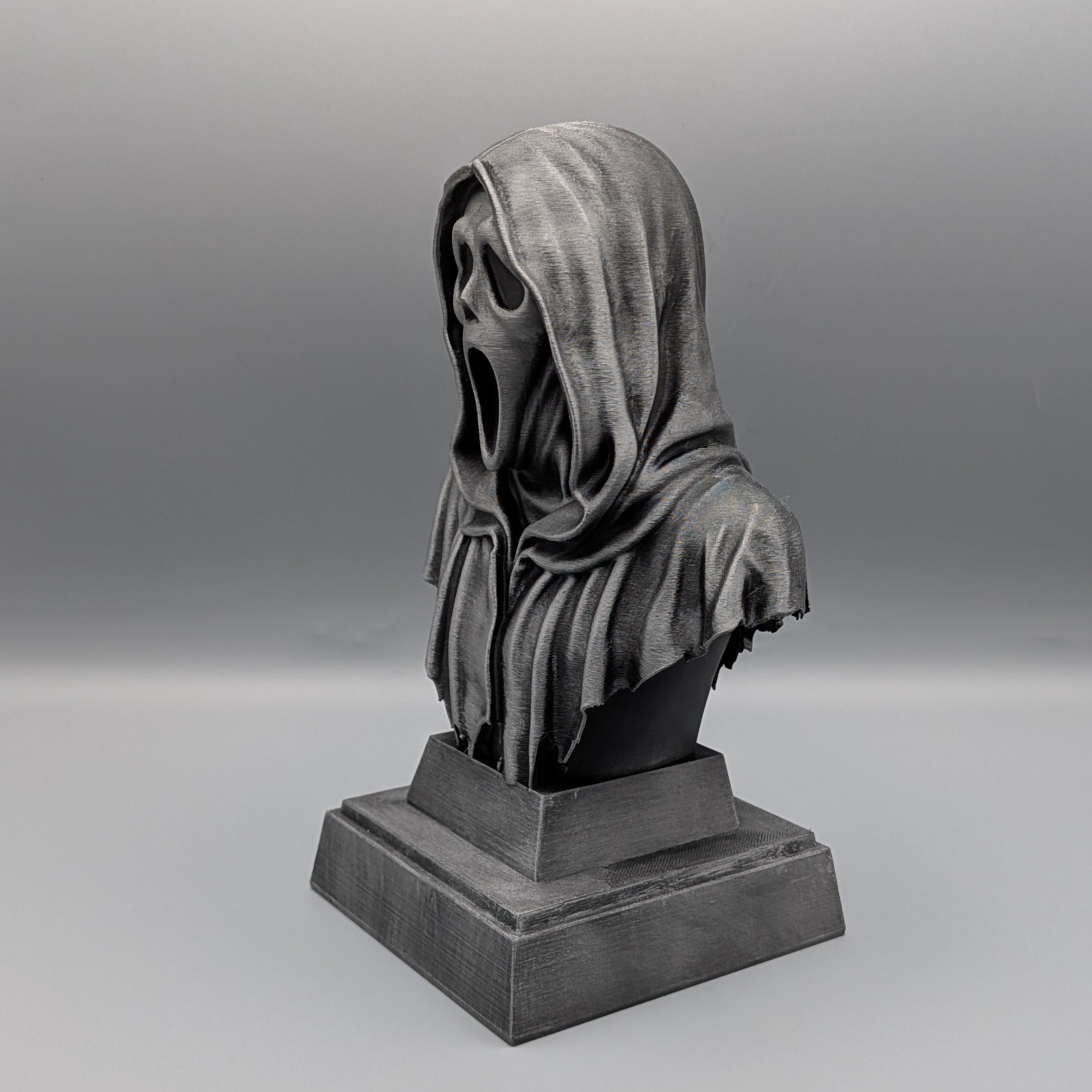 Left-hand side view of the hand-painted Ghostface tribute bust showing the mask, hood and silver metallic finish