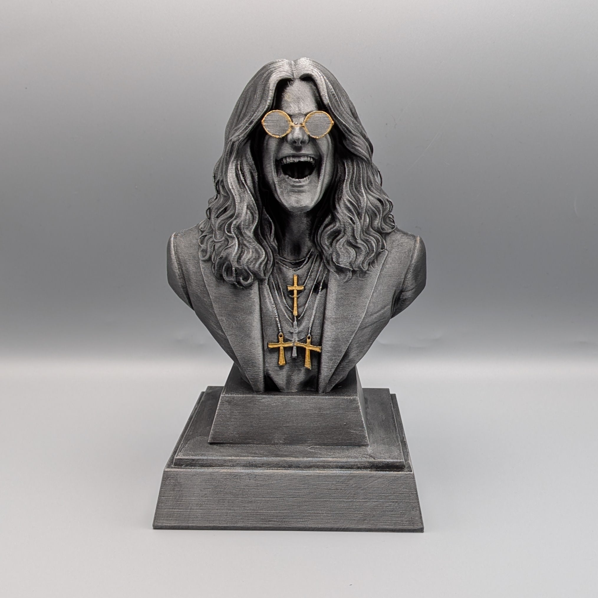 Rock Legend Tribute Bust inspired by Ozzy, detailed rock icon sculpture with gold glasses and crosses – front view