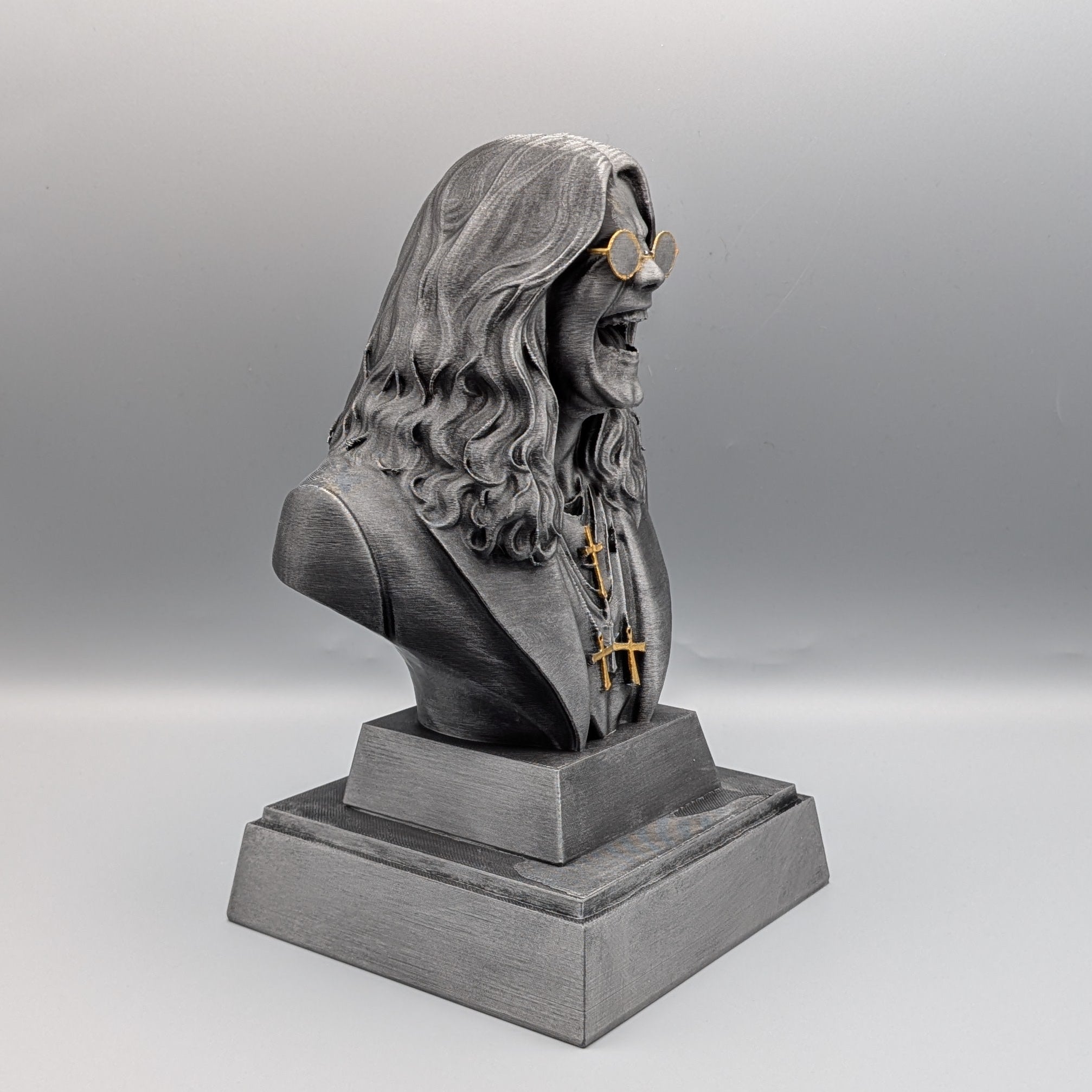 Rock Legend Tribute Bust inspired by Ozzy, detailed rock icon collectible sculpture with long hair and round glasses – side view