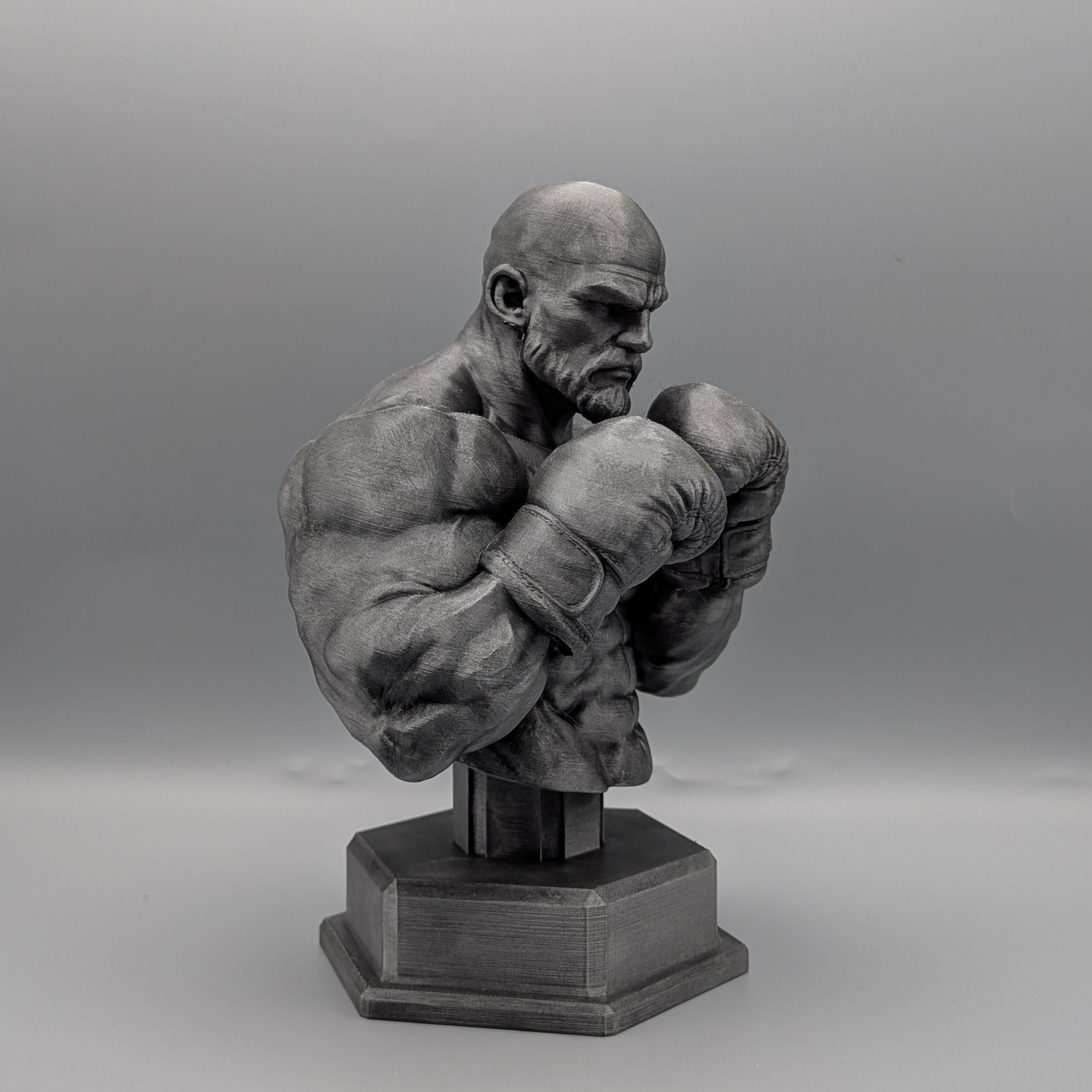 Heavyweight boxer bust side view showing muscular detail and stance
