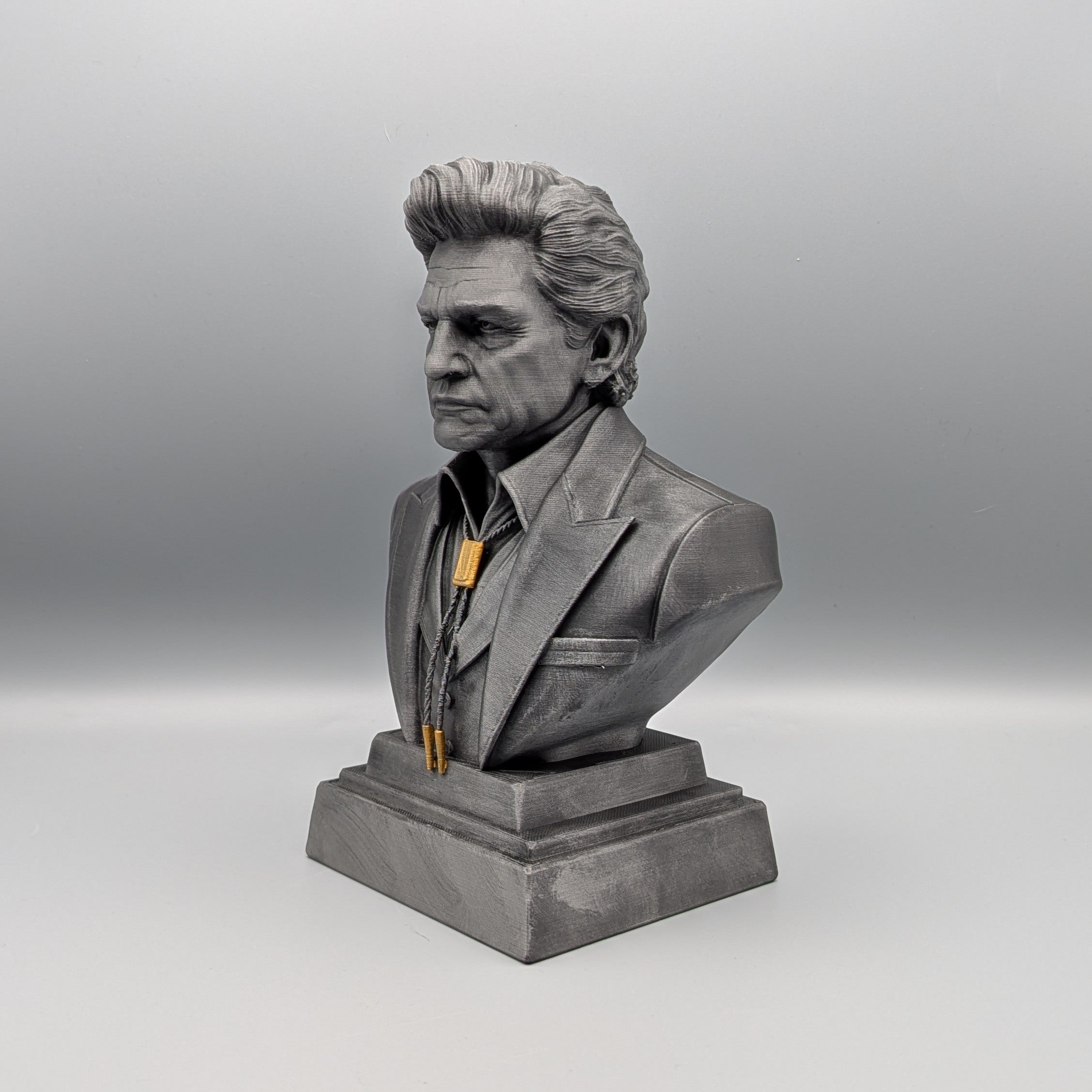 Johnny Cash bust angled view highlighting facial features and silhouette
