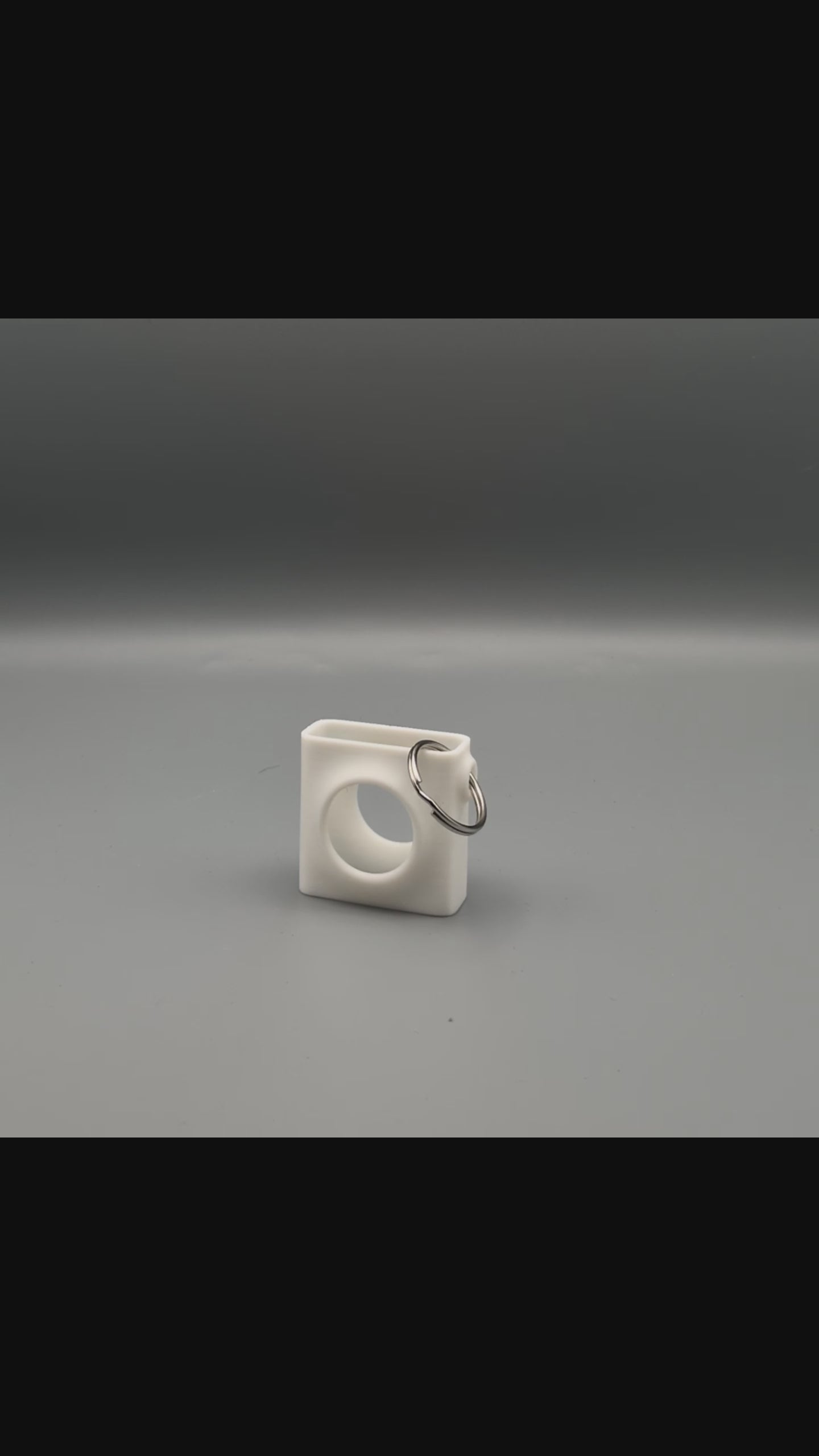 Zorble fidget toy being squeezed and spun in case demonstration