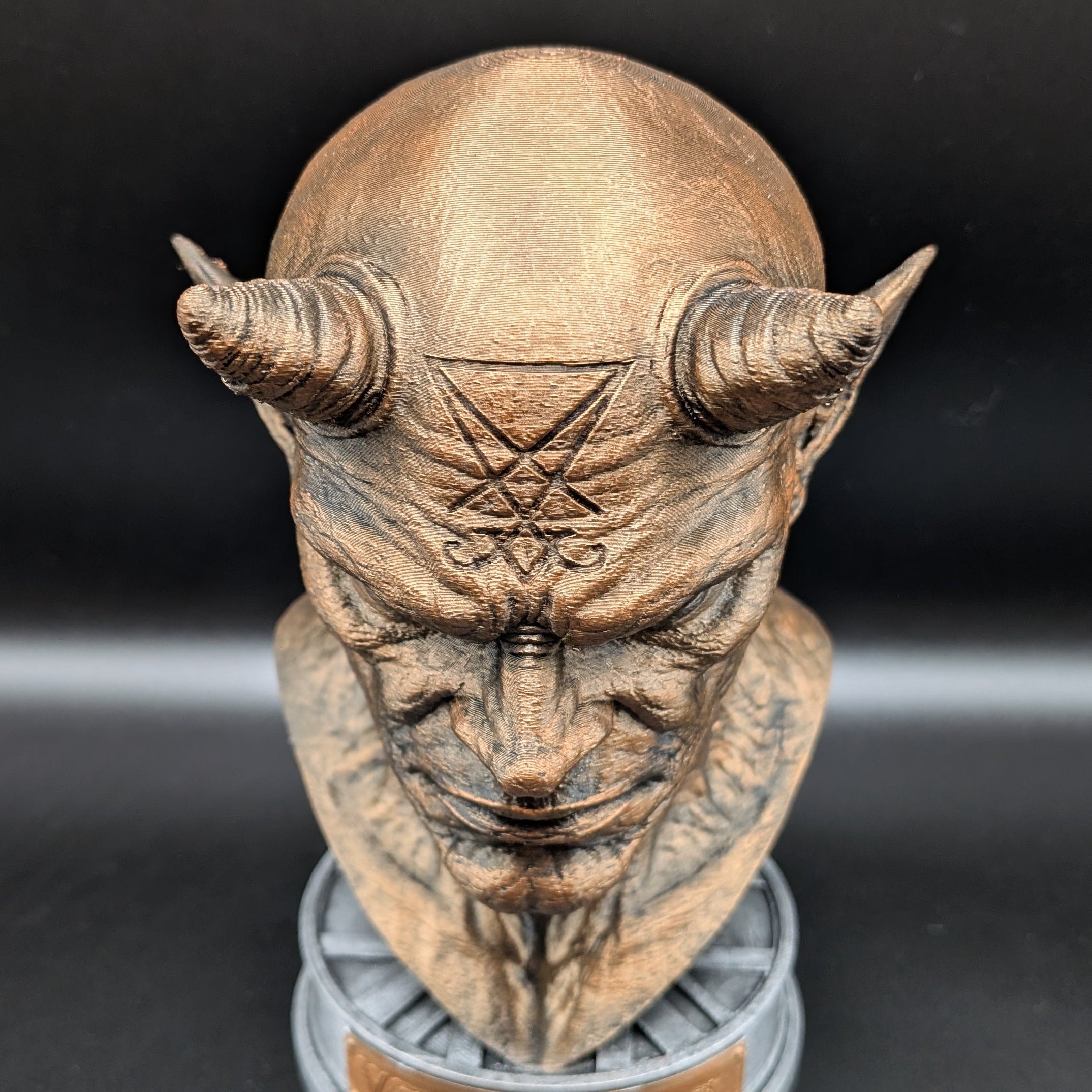 Top view of Official Venom Inc. Mascot Bust with engraved forehead symbol
