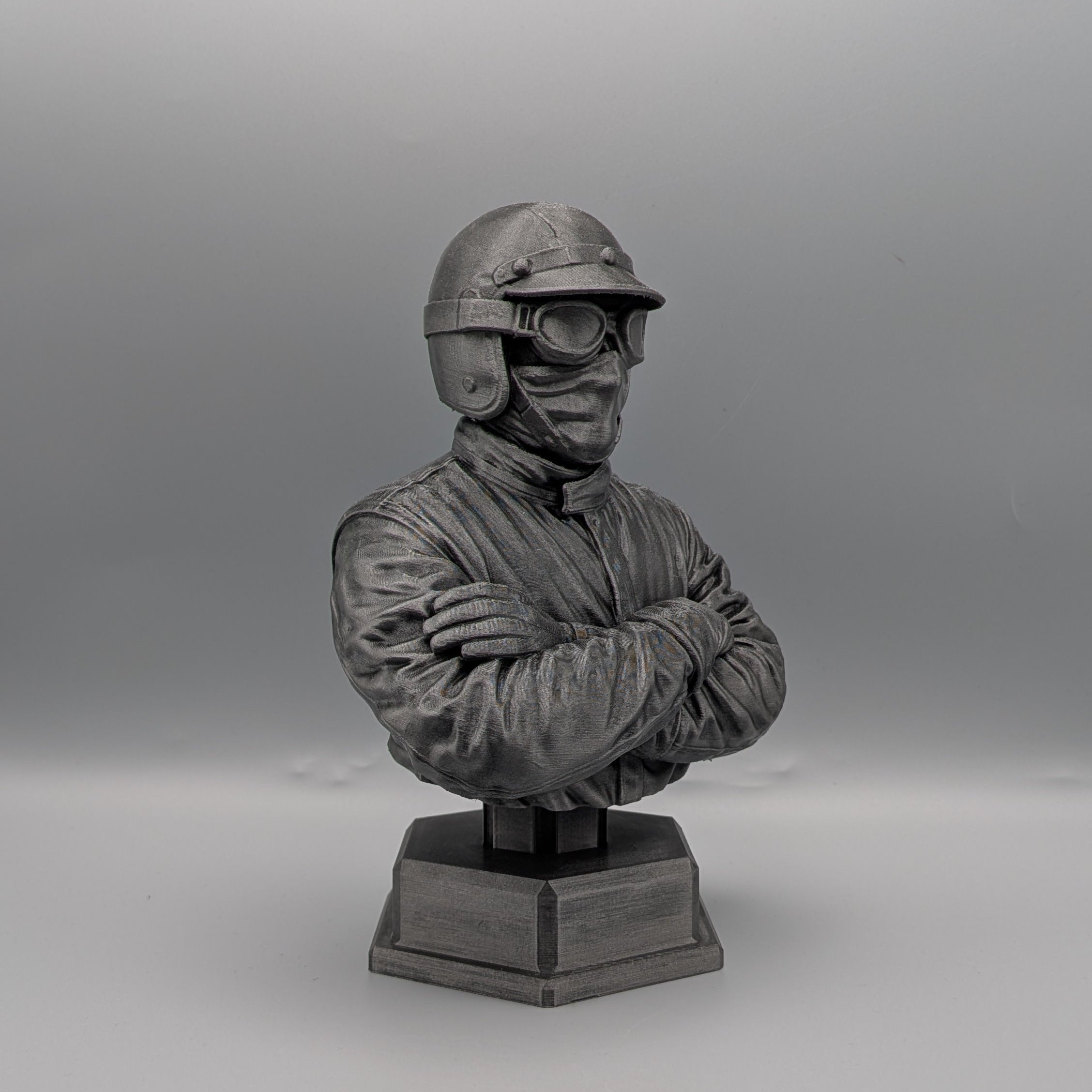 Vintage racer bust side view showing helmet and racing suit details